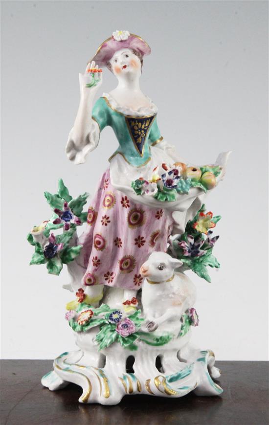 A fine Bow figure of a woman standing beside a sheep, c.1755, 18cm